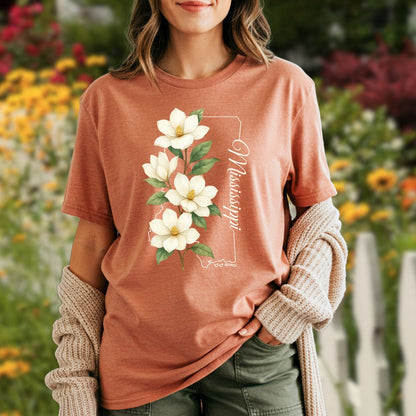 Garment-dyed, relaxed-fit terracotta t-shirt with a magnolia illustration and "Mississippi" text.