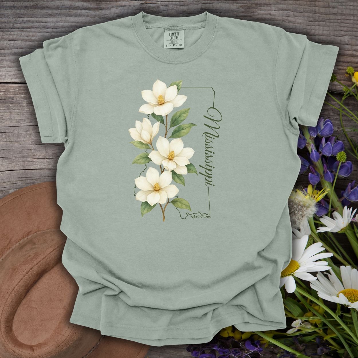 Bay S, relaxed-fit, garment-dyed cotton t-shirt with a magnolia illustration and Mississippi state outline.