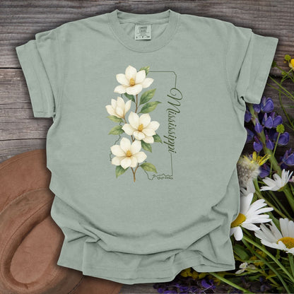 Bay S, relaxed-fit, garment-dyed cotton t-shirt with a magnolia illustration and Mississippi state outline.