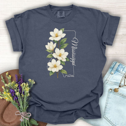 Denim S t-shirt with a white magnolia illustration and Mississippi state outline.