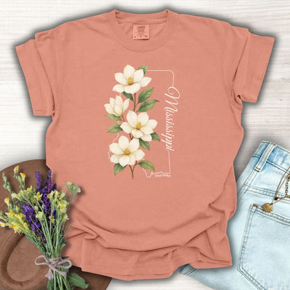 Terracotta relaxed-fit cotton t-shirt with a magnolia illustration and Mississippi state outline.