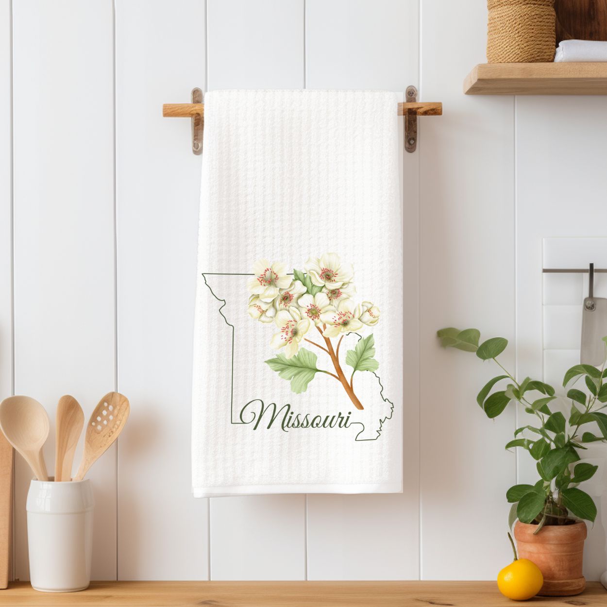 White microfiber tea towel with Missouri outline and cream-and-pink hawthorn blooms.