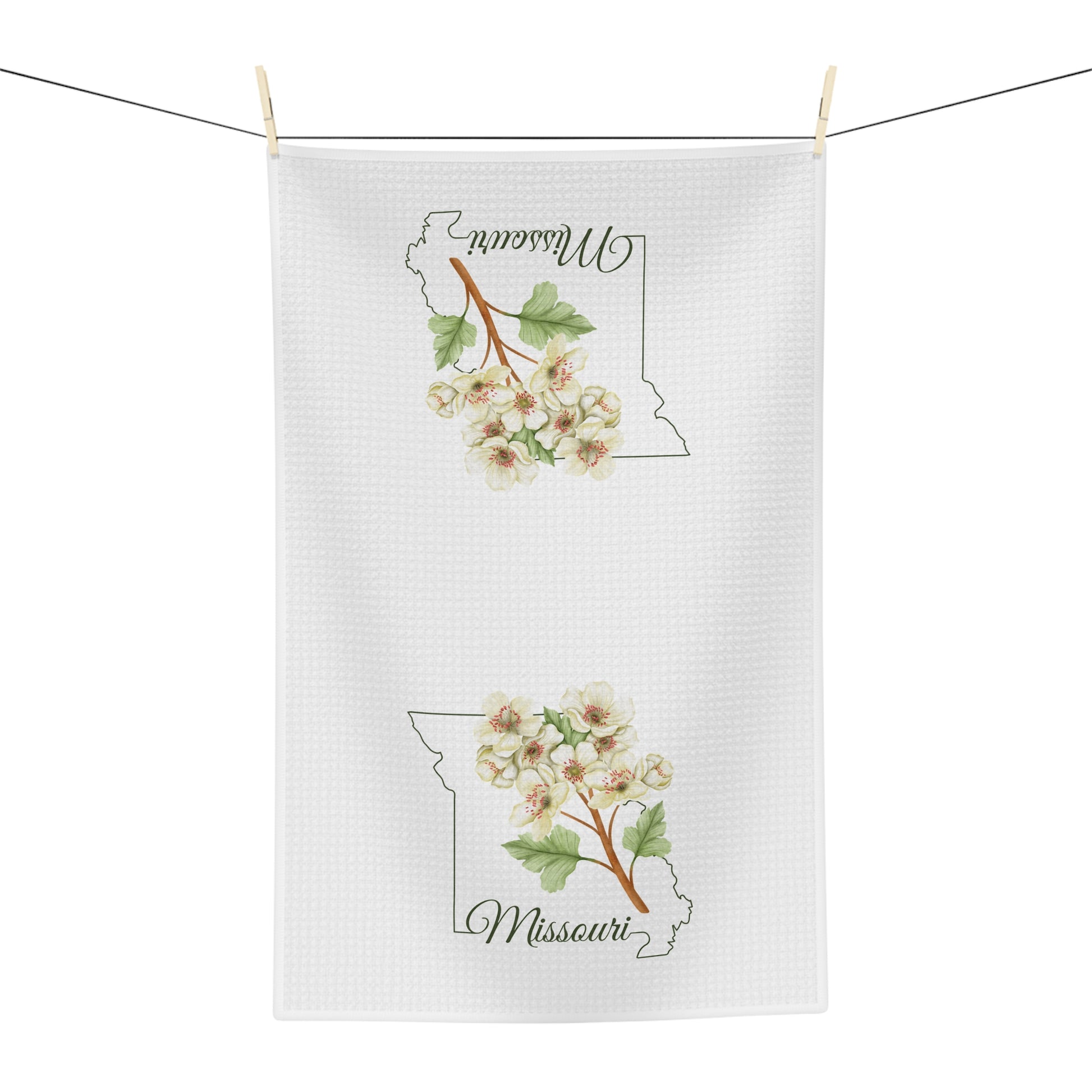 White microfiber tea towel with Missouri state outline and cream-and-pink hawthorn blooms.