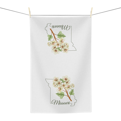 White microfiber tea towel with Missouri state outline and cream-and-pink hawthorn blooms.