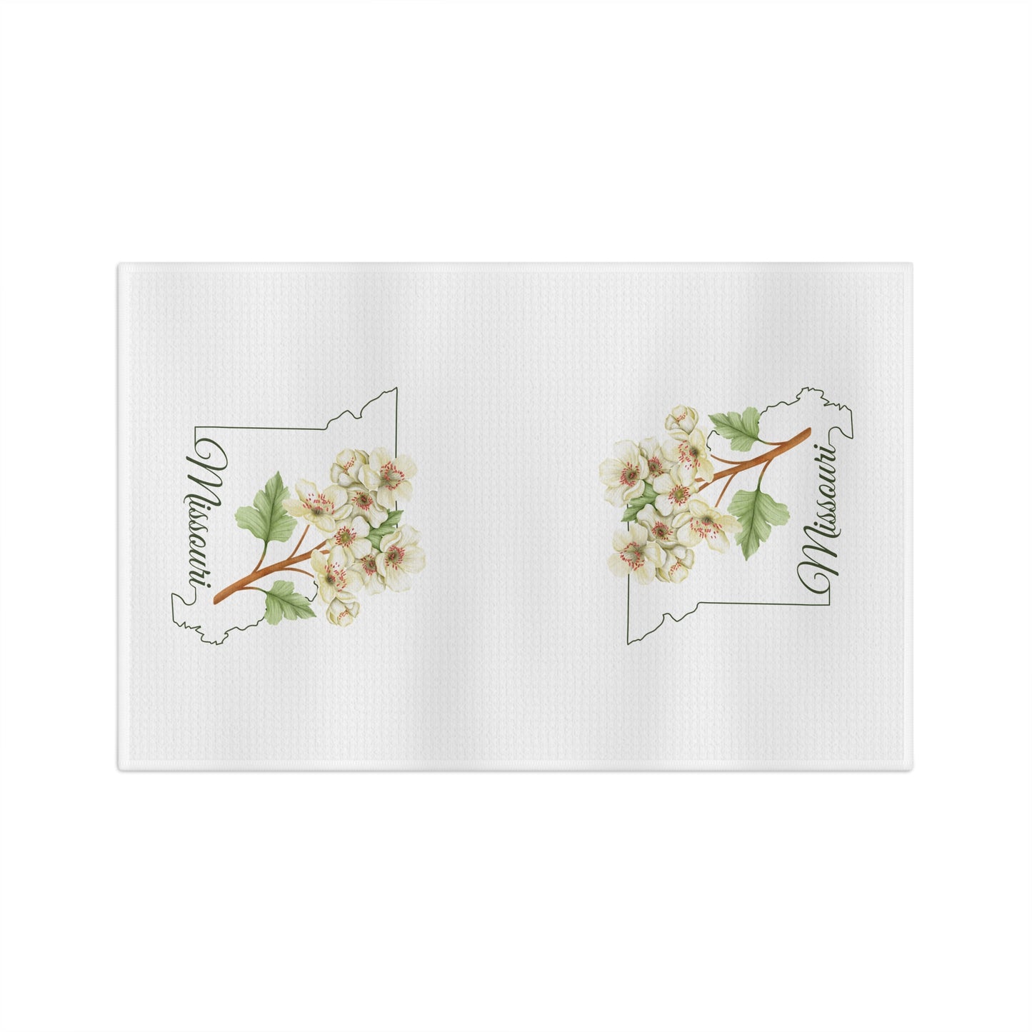 White microfiber tea towel with two cream-and-pink hawthorn branch designs over Missouri outlines.