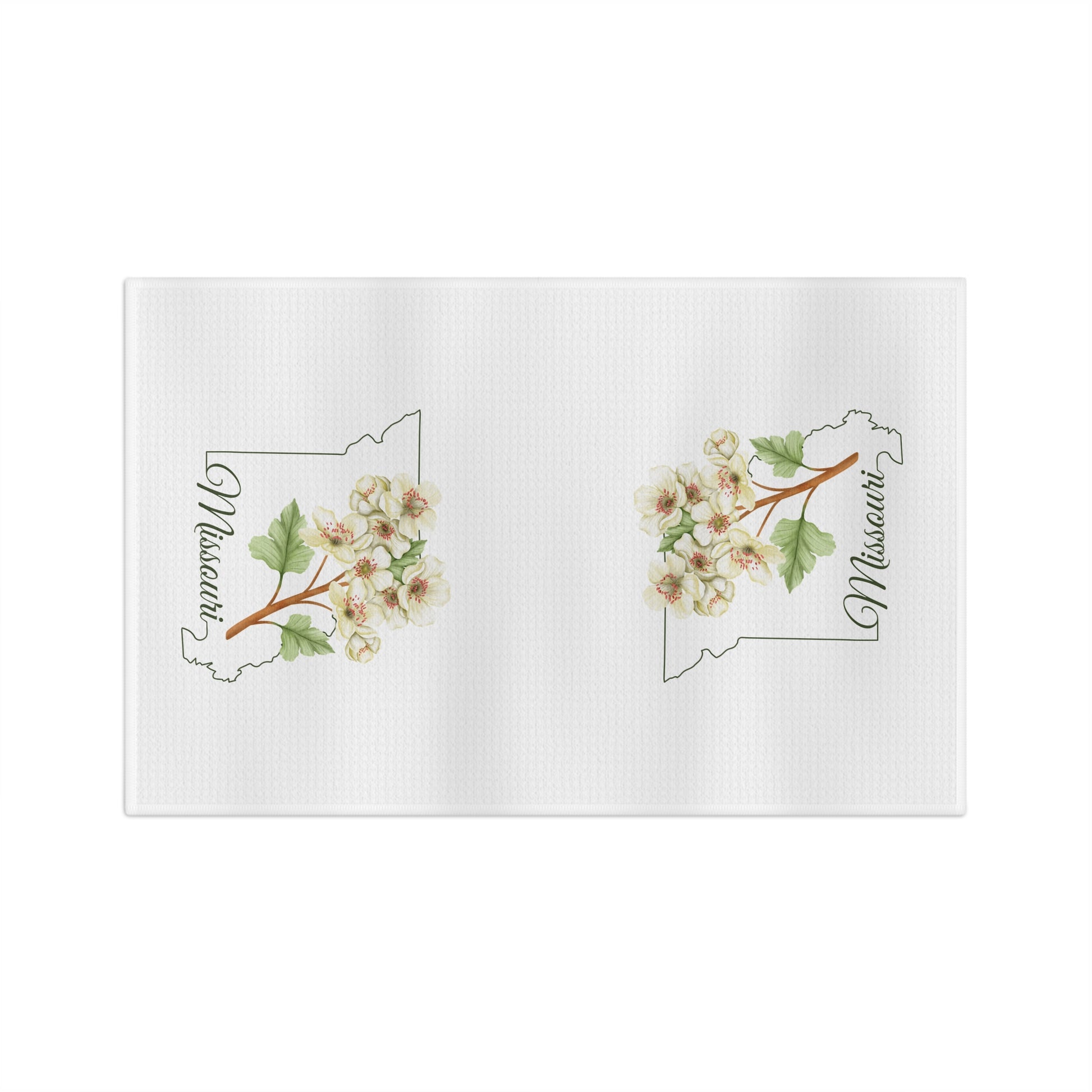 White microfiber tea towel with two cream-and-pink hawthorn branch designs over Missouri outlines.