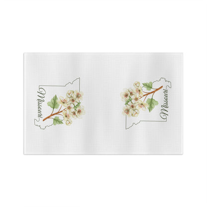 White microfiber tea towel with two cream-and-pink hawthorn branch designs over Missouri outlines.