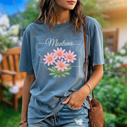 Relaxed-fit, garment-dyed blue cotton t-shirt with a Montana outline and pink bitterroot wildflowers.