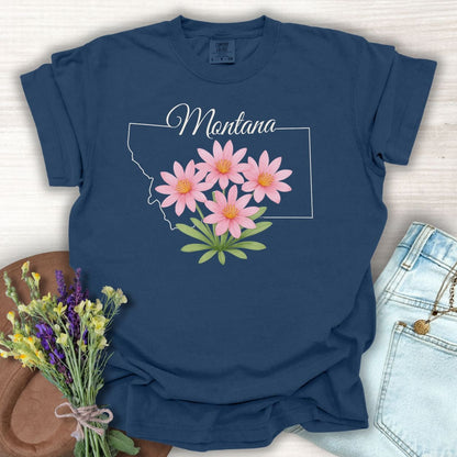 True Navy S-size cotton t-shirt with a Montana outline and pink Bitterroot wildflowers.