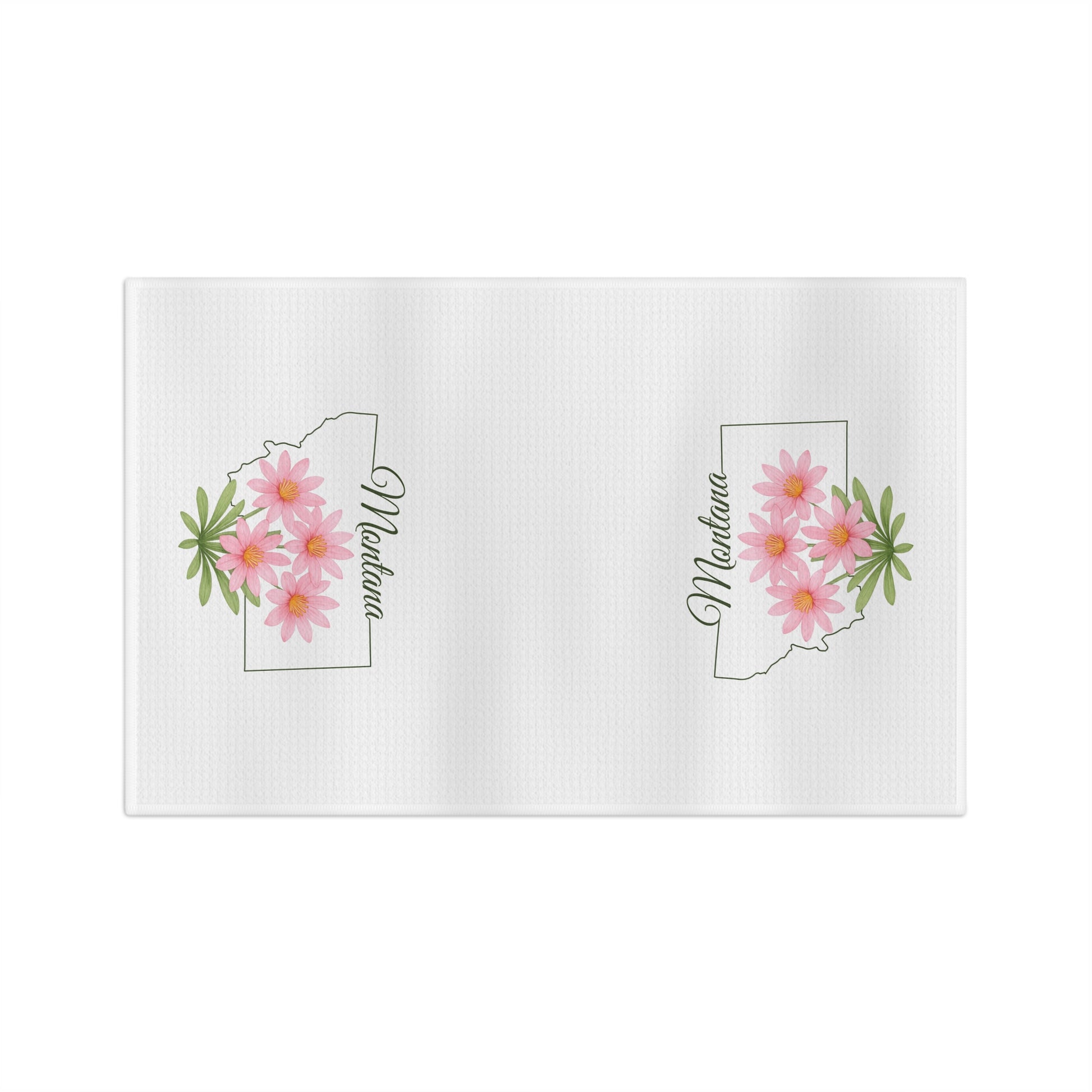 White microfiber tea towel with Montana state outline, pink bitterroot flowers, and "Montana" script.