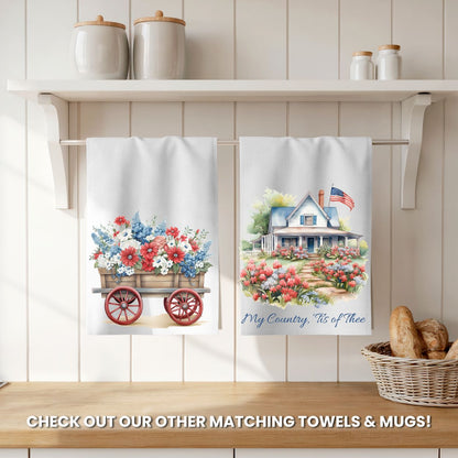 Two white microfiber tea towels, one with a patriotic floral wagon, the other with a country house and flag.
