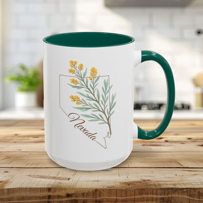 15oz white ceramic mug with green interior and handle, featuring a watercolor Nevada state outline and sagebrush design.