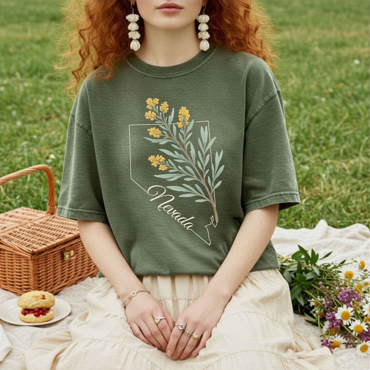 Relaxed-fit, sage green Nevada State Flower T-shirt with a hand-drawn sagebrush design.