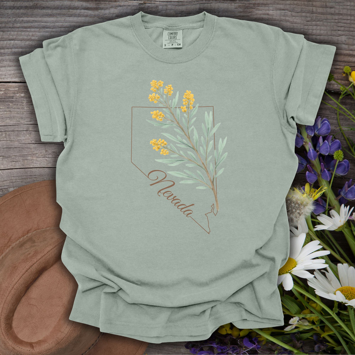 Sagebrush green Nevada floral state flower t-shirt with hand-drawn yellow wildflowers and state outline.