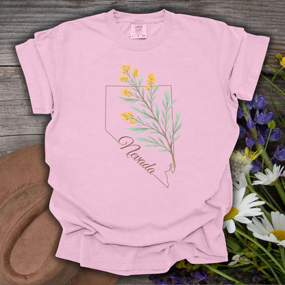 Blossom pink relaxed-fit cotton tee with a hand-drawn Nevada state outline and yellow sagebrush floral design.