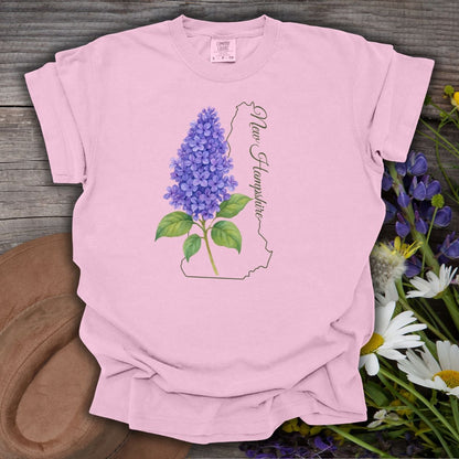 Blossom pink cotton t-shirt with watercolor blue lilac, New Hampshire outline, and script.