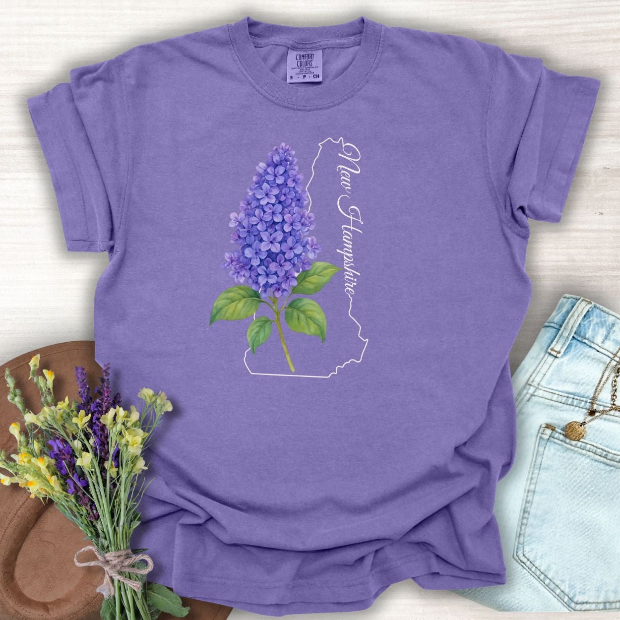 Grape S t-shirt with watercolor lilac, New Hampshire outline, and script.