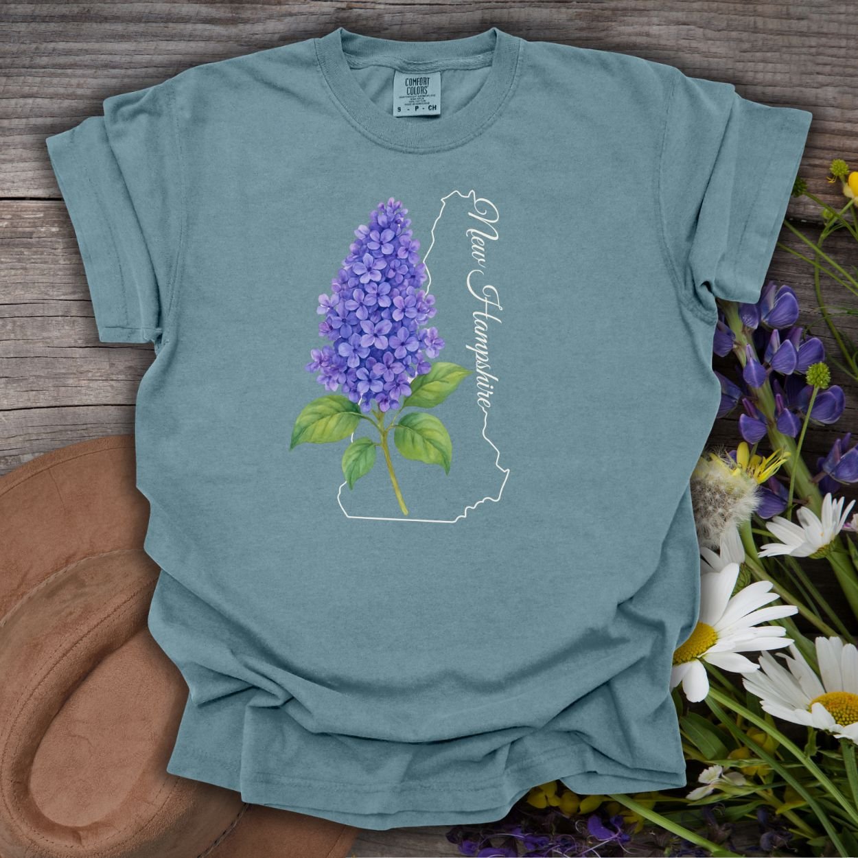 Ice Blue S t-shirt with a watercolor lilac sprig and New Hampshire state outline.