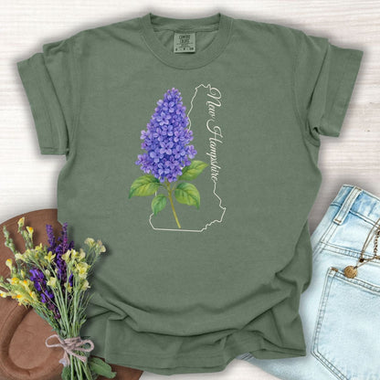 Moss green cotton t-shirt with a watercolor blue lilac sprig and New Hampshire state outline.