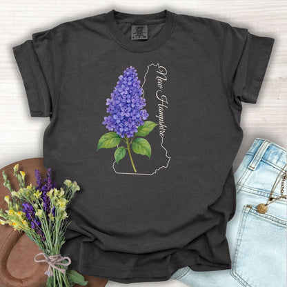 Pepper S t-shirt with watercolor blue lilac, New Hampshire outline, and script.