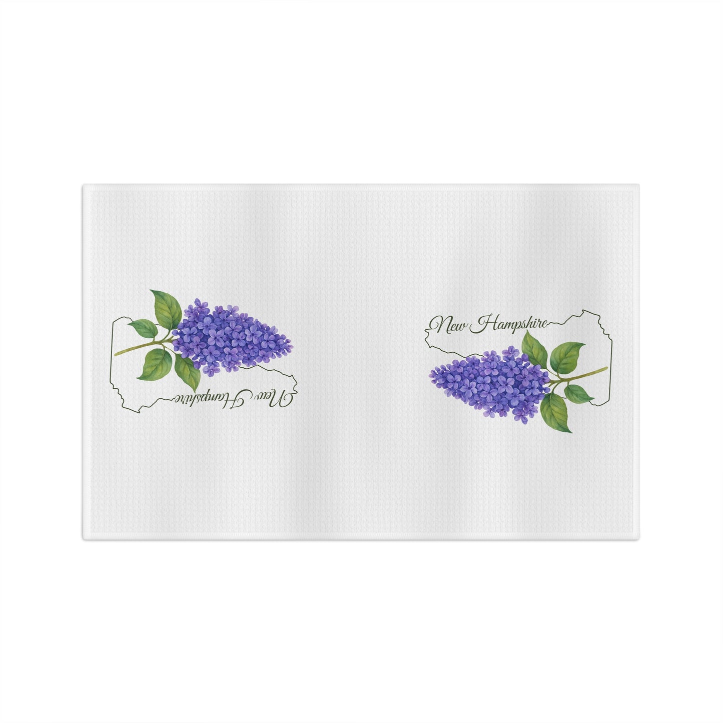 White microfiber tea towel with two purple lilac sprigs and "New Hampshire" text inside state outlines.