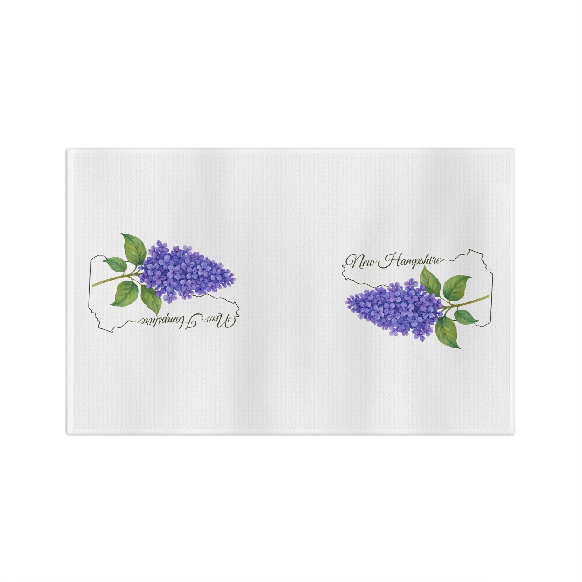 White microfiber tea towel with two purple lilac sprigs and "New Hampshire" text inside state outlines.