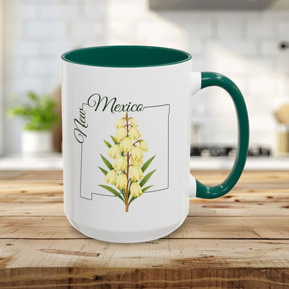 15oz white ceramic mug with green interior and handle, featuring a New Mexico Yucca flower design.