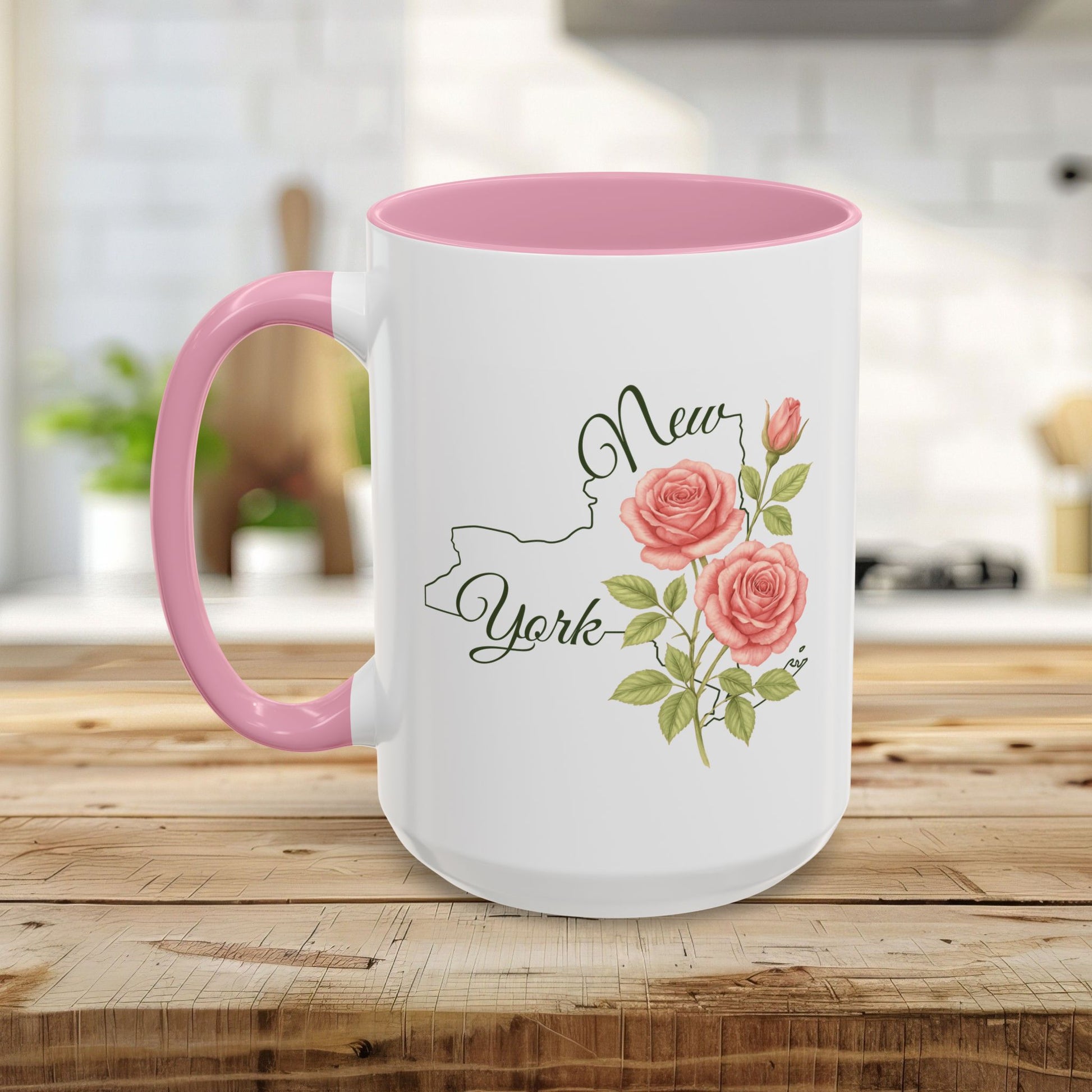 White ceramic mug with pink interior and handle, featuring a New York State outline and watercolor pink roses.