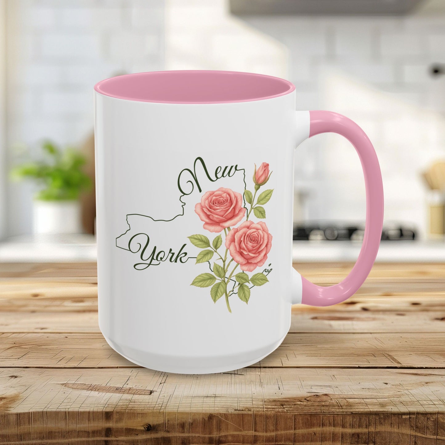 15oz ceramic mug with pink interior/handle, featuring a New York outline and watercolor roses.