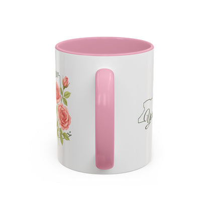 White ceramic mug with pink interior and handle, featuring watercolor roses and a New York state outline.