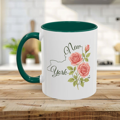 White ceramic mug with green interior and handle, featuring a New York outline and watercolor pink roses.