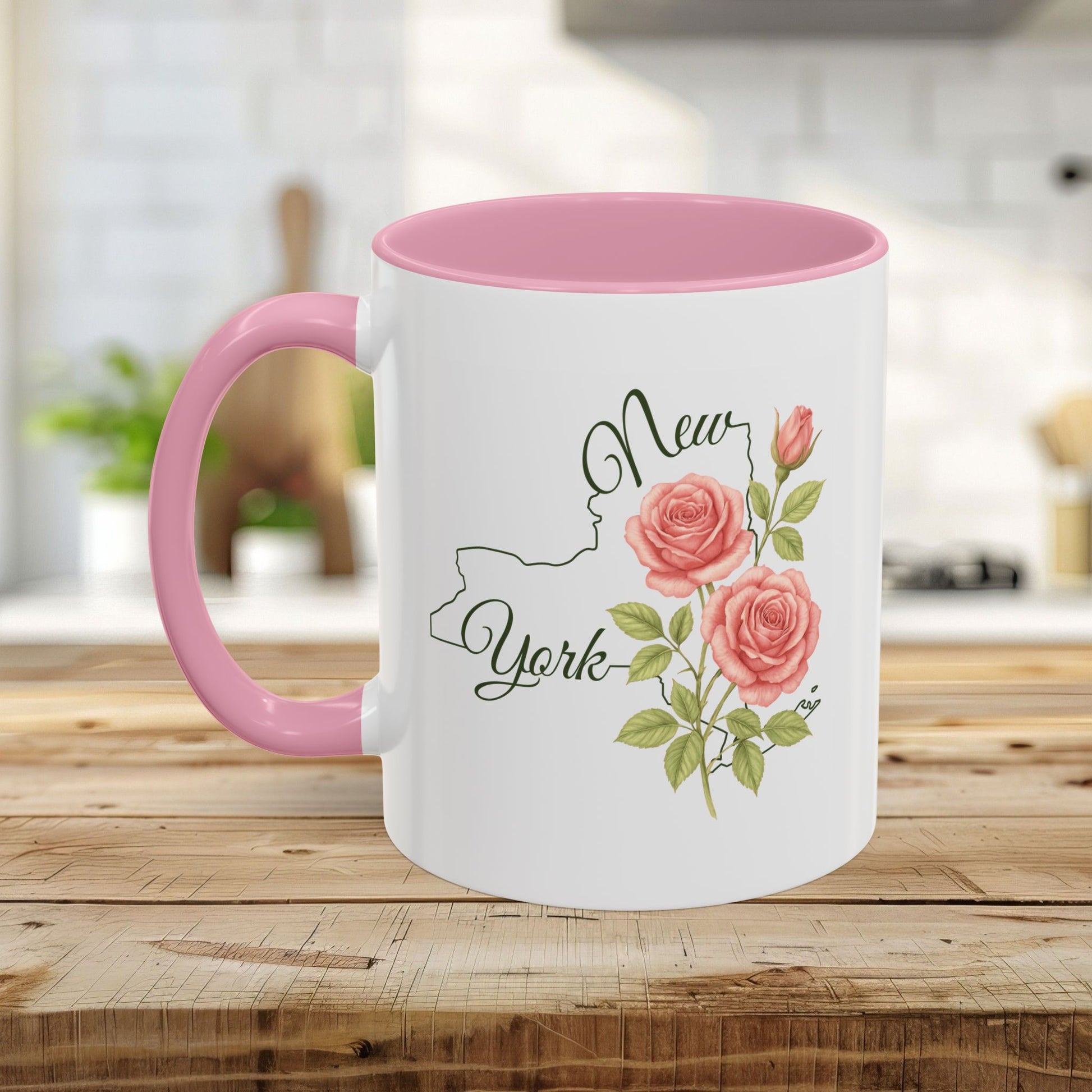 White ceramic mug with pink interior and handle, featuring a New York outline and watercolor roses.