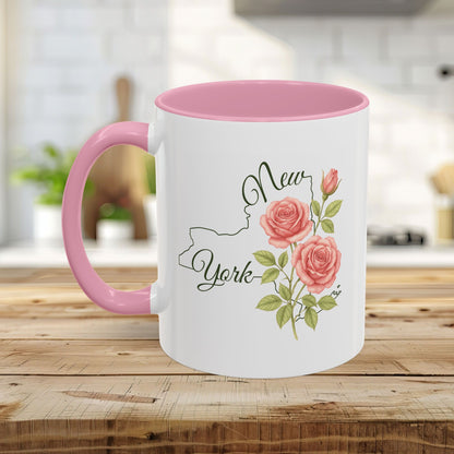 White ceramic mug with pink interior and handle, featuring a New York outline and watercolor roses.