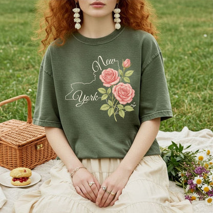 Garment-dyed olive green t-shirt with a New York outline and pink painterly roses.