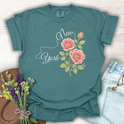 Blue Spruce cotton t-shirt with a New York state outline, "New York" script, and painterly pink roses.