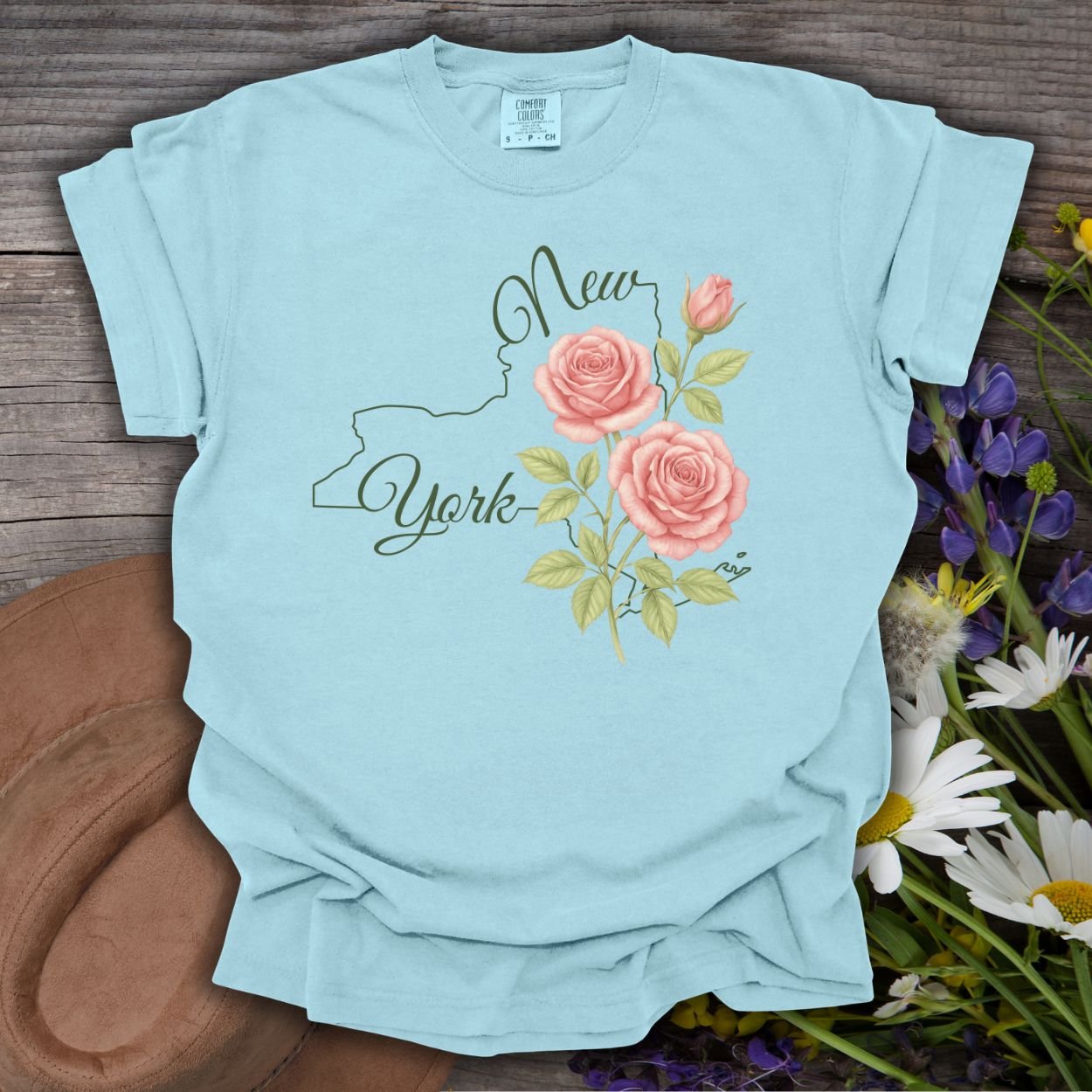 Chambray blue garment-dyed cotton t-shirt with New York outline and painterly pink roses.