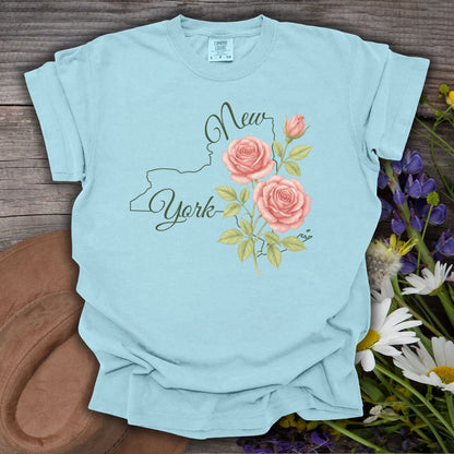 Chambray blue garment-dyed cotton t-shirt with New York outline and painterly pink roses.