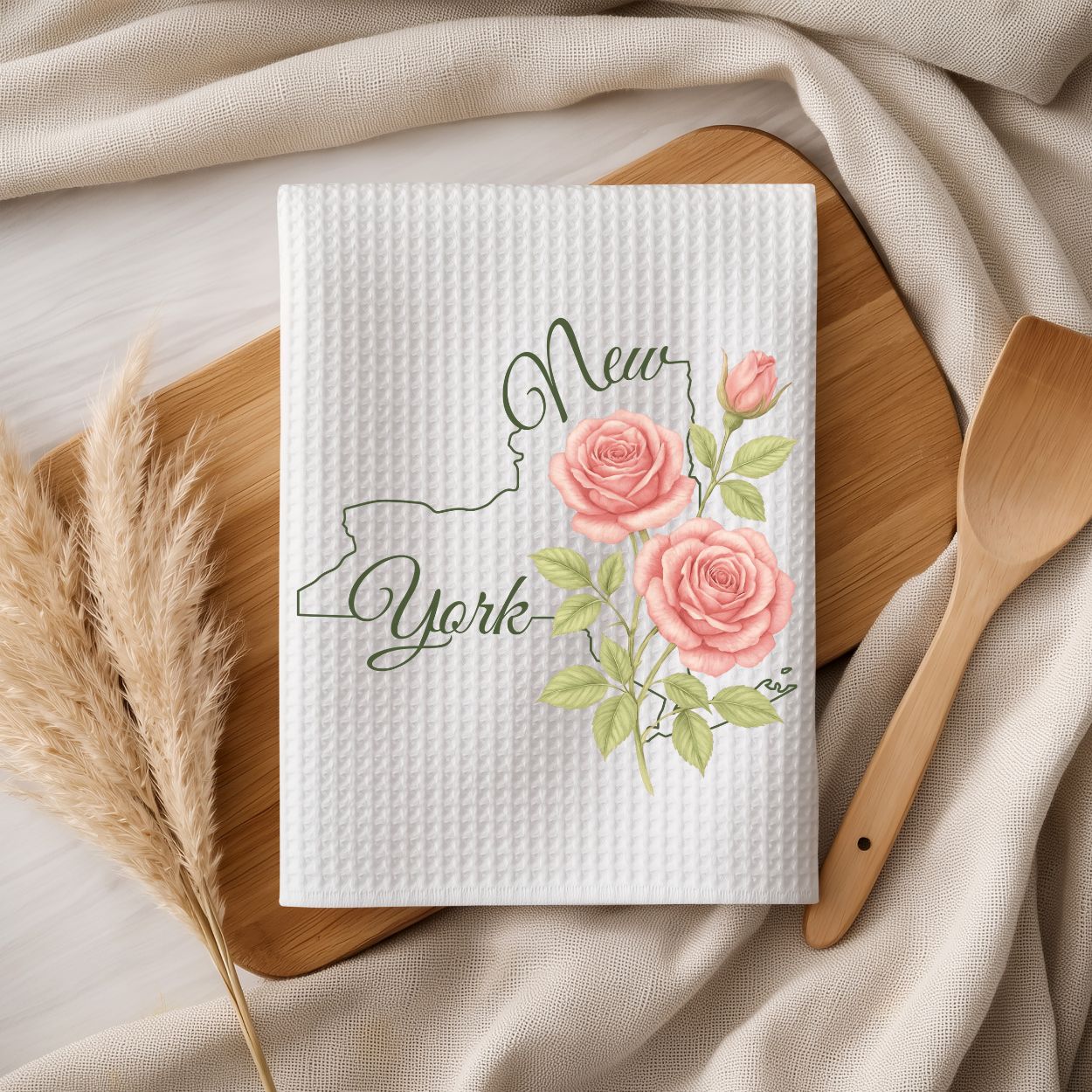 White microfiber tea towel with a New York state outline and pink rose floral design.