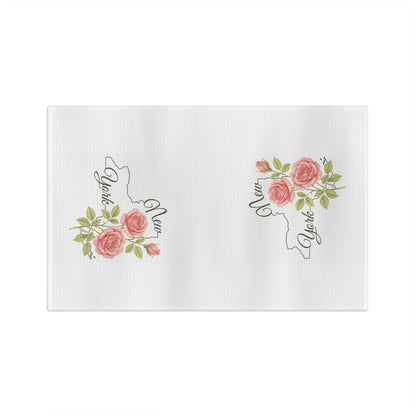 White microfiber tea towel with pink roses and green leaves framing a "New York" state outline.