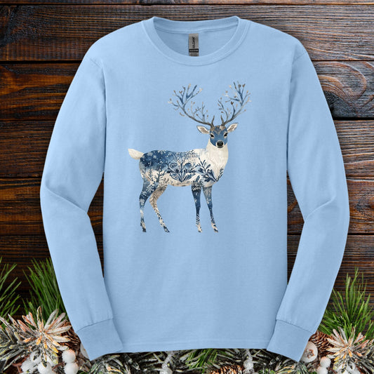 Light blue long-sleeve cotton tee with a hand-painted stag silhouette featuring winter landscape texture.