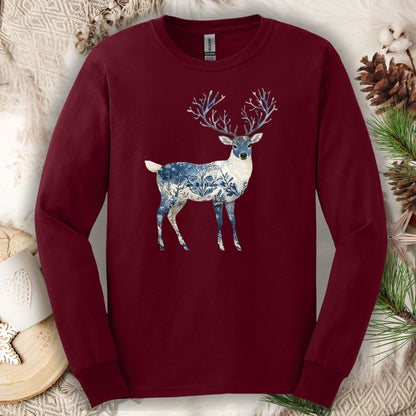 Maroon long-sleeve tee with a hand-painted stag silhouette featuring blue and white winter landscape texture.