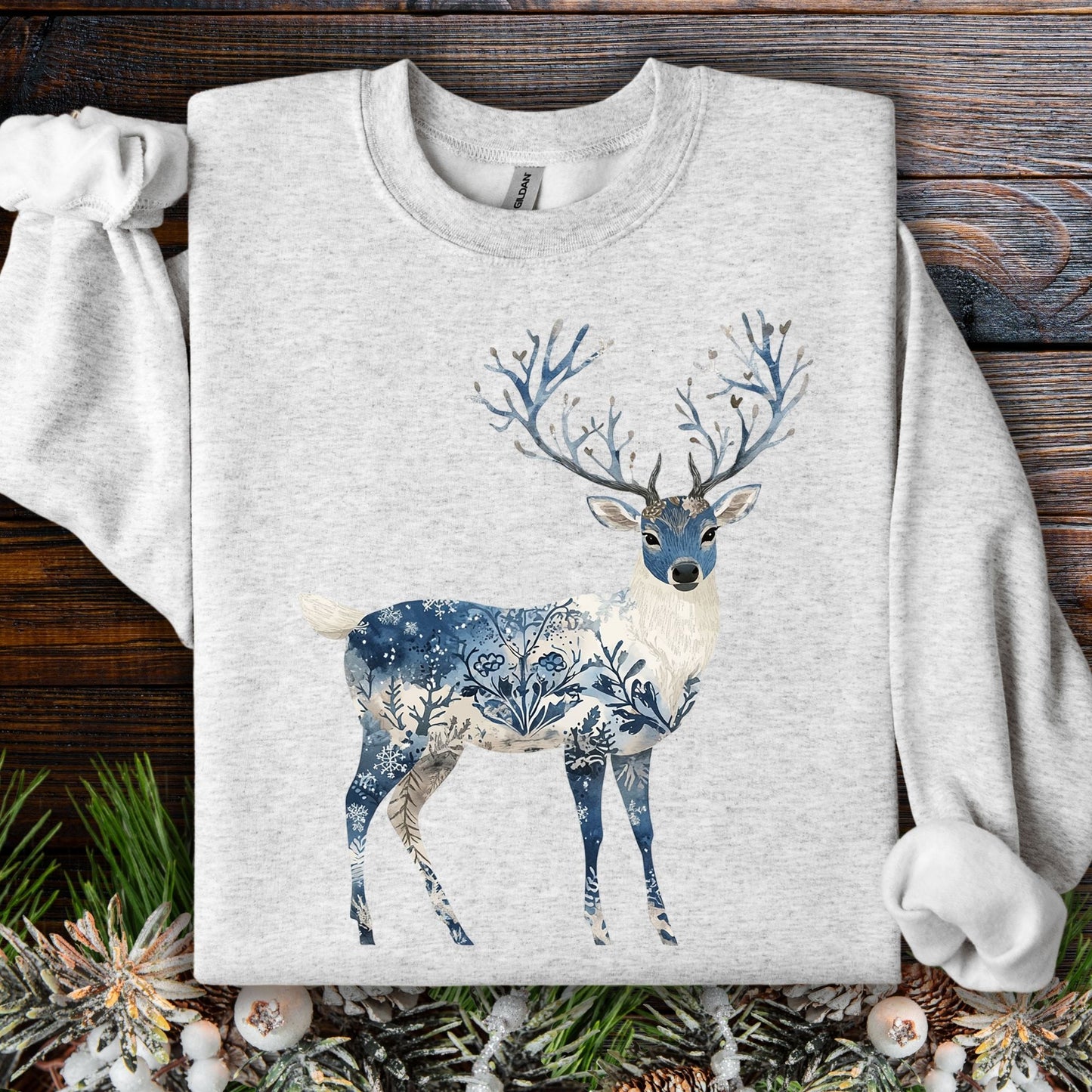 Ash S sweatshirt with a Nordic Chinoiserie winter buck design featuring intricate blue floral and frost patterns.