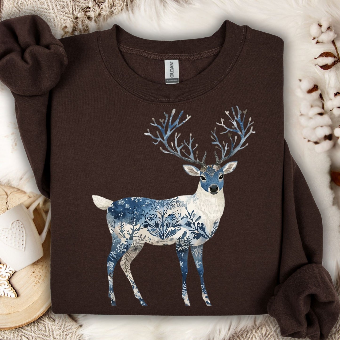 Dark chocolate sweatshirt with a white and blue botanical winter buck design and tree-like antlers.