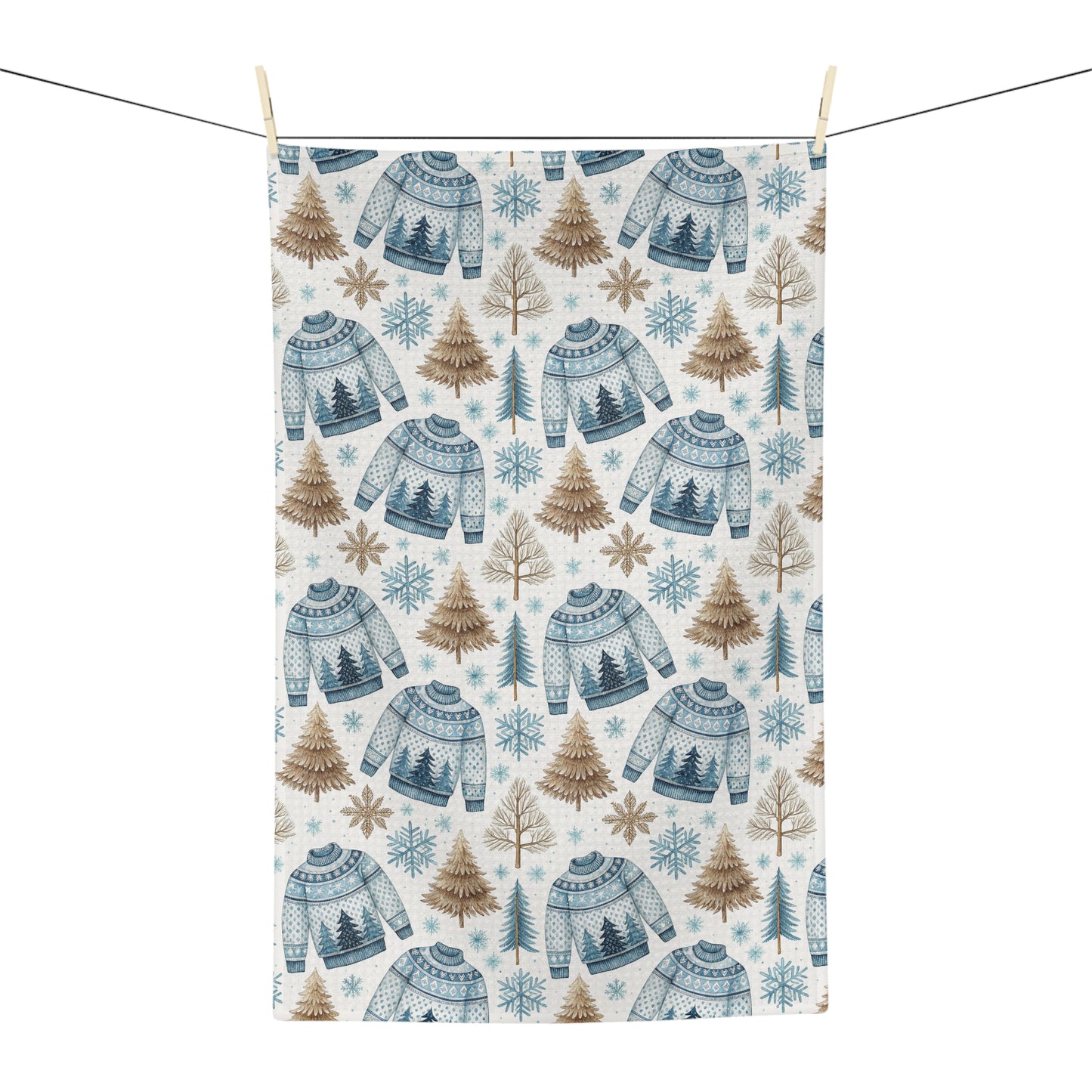 Nordic Fair Isle sweater microfiber tea towel with blue sweaters, pine trees, and snowflakes.