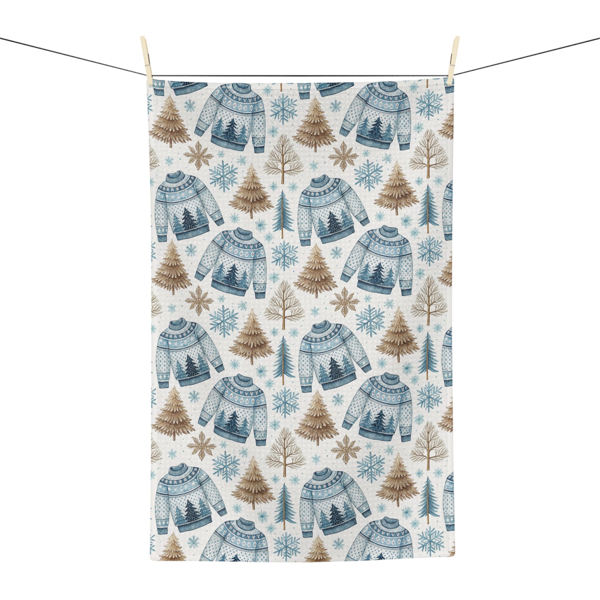 Nordic Fair Isle sweater microfiber tea towel with blue sweaters, pine trees, and snowflakes.