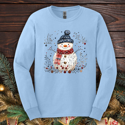 Light blue Gildan Softstyle long sleeve tee with a hand-drawn Nordic folk art snowman design.