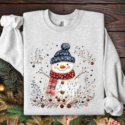 Ash Gildan fleece sweatshirt with a Nordic folk-art snowman, branches, and berries.