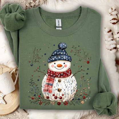 Military Green Gildan fleece sweatshirt with a Nordic folk-art snowman, berries, and branches.