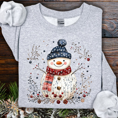 Sport Grey Gildan sweatshirt with a Nordic folk-art snowman, branches, and berries design.