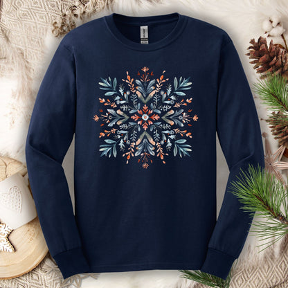 Navy Gildan Softstyle long sleeve tee with watercolor Scandinavian snowflake design in red and blue.